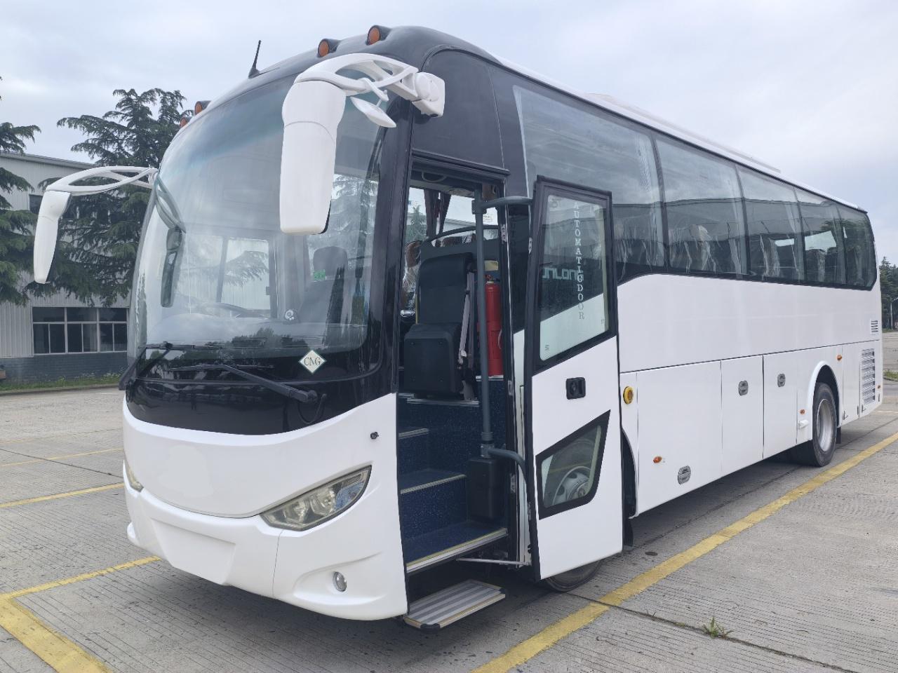 White 6102 CNG right-hand-drive bus with front door open
